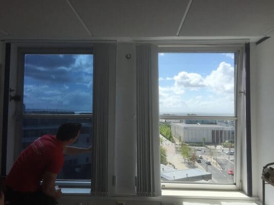 A man installing tinted window film