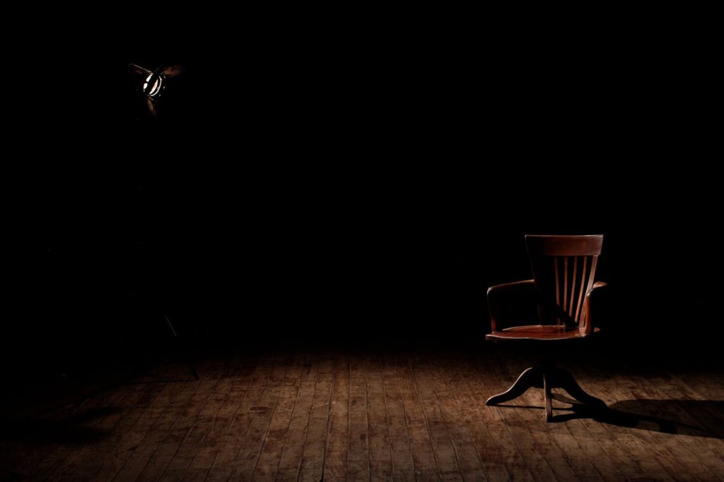 A chair in a dark room