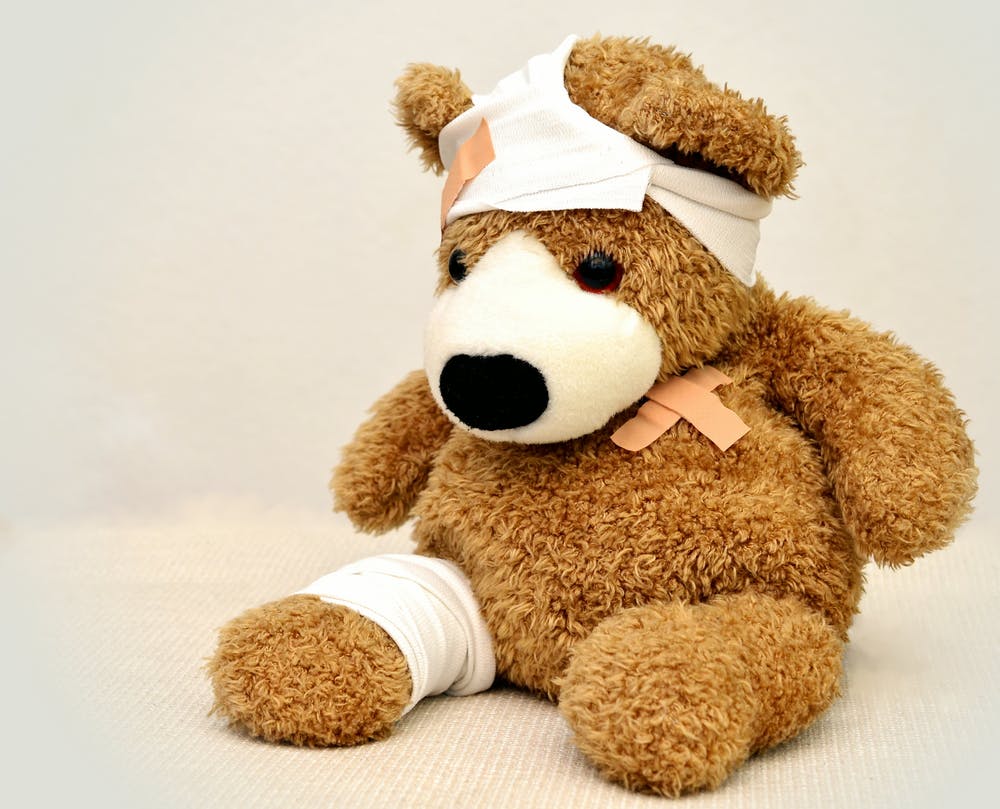 teddy bear with a bandage