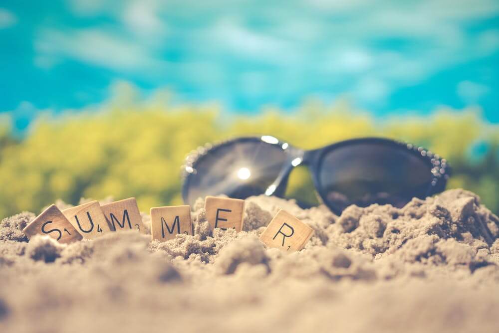 sun glasses on the sand