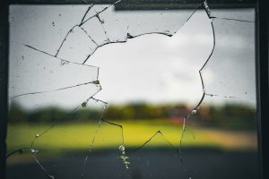 smashed window to represent security window film for commercial properties
