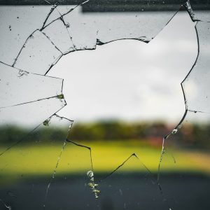 smashed window to represent security window film for commercial properties