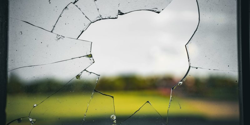 smashed window to represent security window film for commercial properties